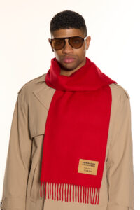 A folded red tartan cashmere scarf.