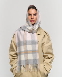 A folded tartan cashmere scarf in a signature Scottish gift box.