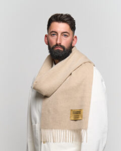 A cream cashmere scarf in a beautifully crafted gift box.